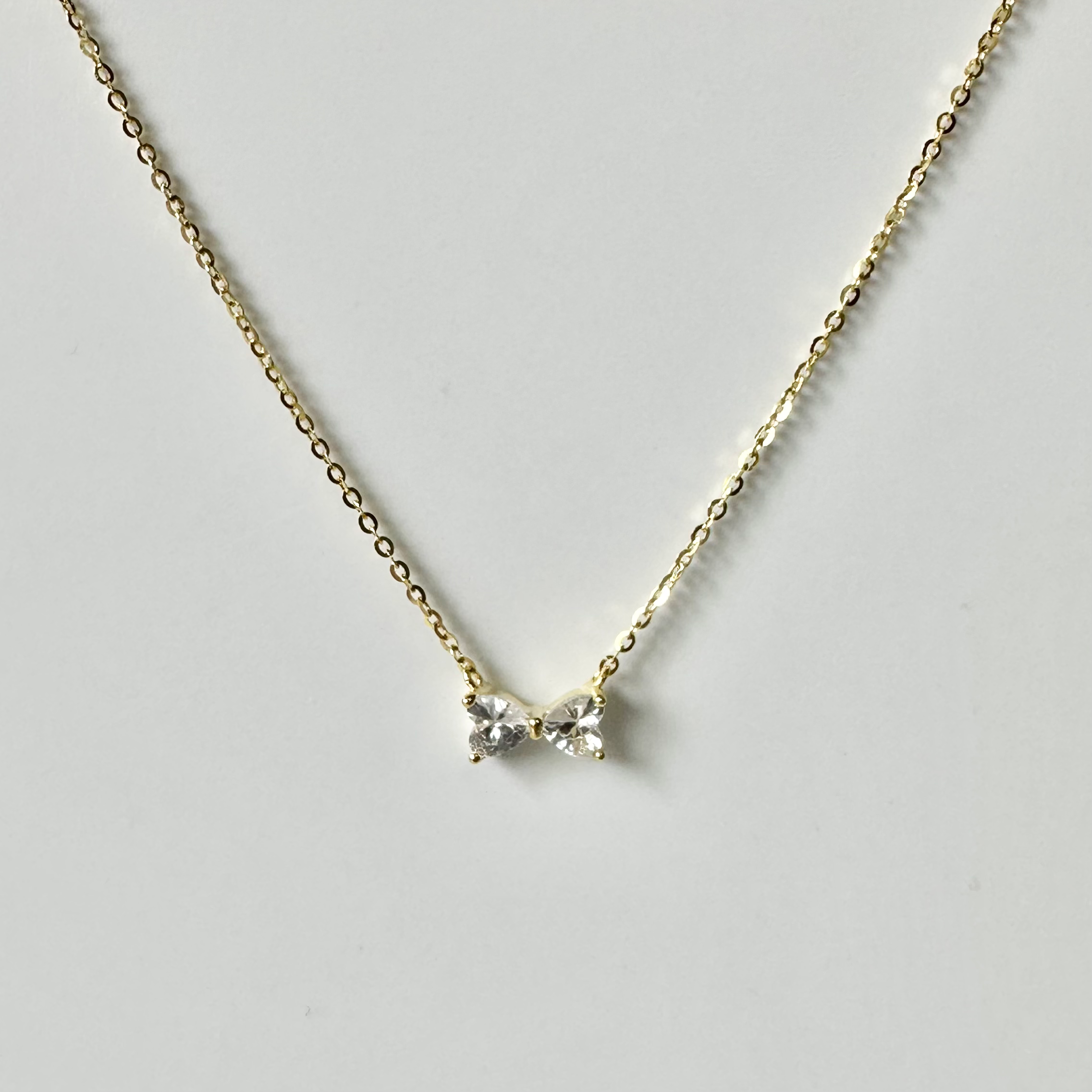 Gold Dainty CZ Bow Necklace image 0